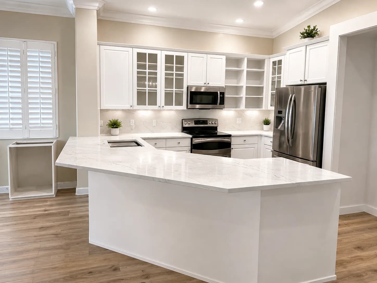 Porcelain waterfall island in a finished kitchen with dark cabinetry